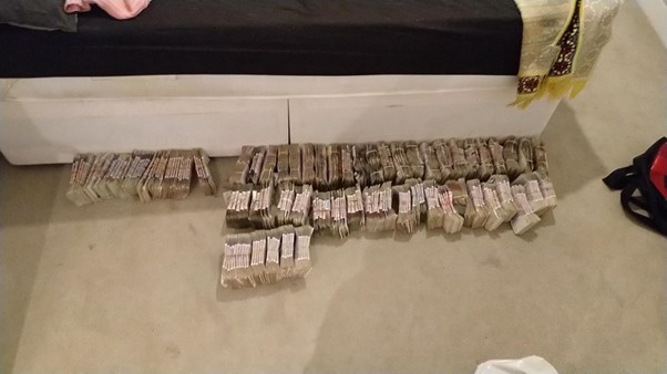 Photo of cash shared between OCG members
