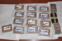 Blocks of wrapped cocaine with Nike tick on packaging