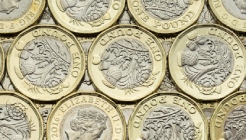 Pound coins laid flat, side by side