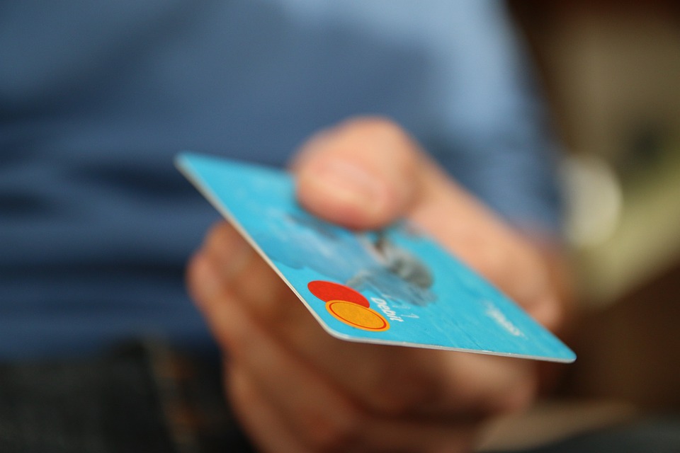 Man holding out bank card